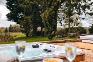 champagne glasses next to hot tub